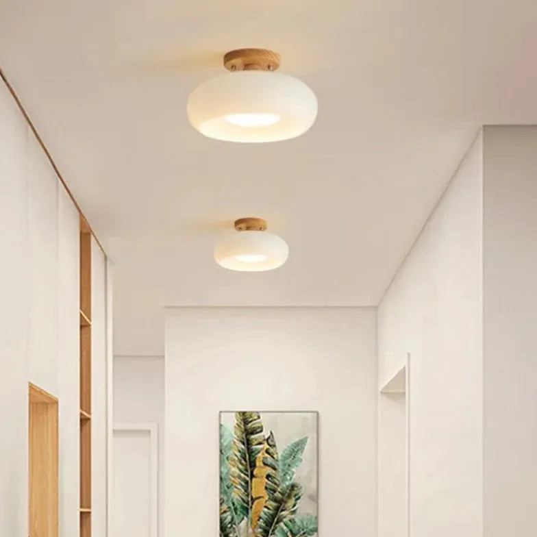 Elliptical Glass Corridor with Recessed Ceiling Lights